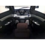 Pushpak 8000 driver's cabin controls close-up. Digital dashboard, accelerator, brakes, etc.