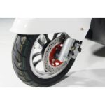 Pushpak 8000 rear tire close-up. Durable and sturdy for a smooth ride.