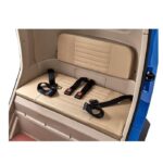 Interior view of a vehicle showing the beige cushioned rear seat with seat belts, highlighting safety features.