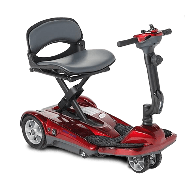 A compact, red, four-wheeled mobility scooter with a cushioned seat, adjustable armrests, and a tiller featuring simple control buttons. The scooter has a footrest and is designed for easy maneuverability, suitable for indoor and outdoor use.