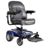 A blue mobility scooter with a padded seat, backrest, and armrests. It has four wheels, with larger ones in the back and smaller ones in the front. There is a control joystick on the right armrest and a footrest at the front. The model name "EZ GO" is visible on the side.