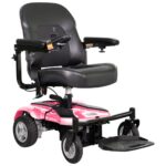 Front side view of the Merits EZ-GO / EZ-GO Deluxe wheelchair in striking pink color, highlighting its vibrant hue, compact design, and user-friendly features