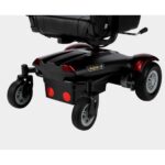 Close-up view of the front wheels and lower frame of the Merits Vision CF 2 wheelchair, showing the strong build and design