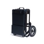 The eFOLDi Lite mobility scooter in its upright folded position, demonstrating how it can stand independently, ready for storage or transportation.