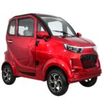 A glossy red Green Transporter Q Express compact electric vehicle, featuring a modern design with black trim, clear windows, and stylish black wheels.