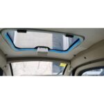 eiling view inside a GIO Golf mobility scooter, showing a sunroof with a blue frame.