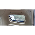 View through the rear window of a GIO Golf mobility scooter, showing a beige interior frame.