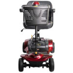 Front view of the Merits Roadster 4 mobility scooter in burgundy, featuring a wide padded seat, front basket, and large rear wheels.