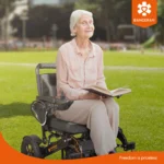 Live image of elderly woman sitting on Bangeran Mamooth wheelchair reading a book in the park.