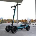 outdoor front angle view of MIA SPYQE 2x4 electric scooter in blue color on city pavement