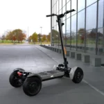 outdoor rear angle view of MIA SPYQE 2x4 electric scooter in gray color parked on pavement