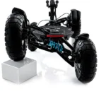 Close up rear view of the MIA Four X2 suspension and large rugged tires on a white background